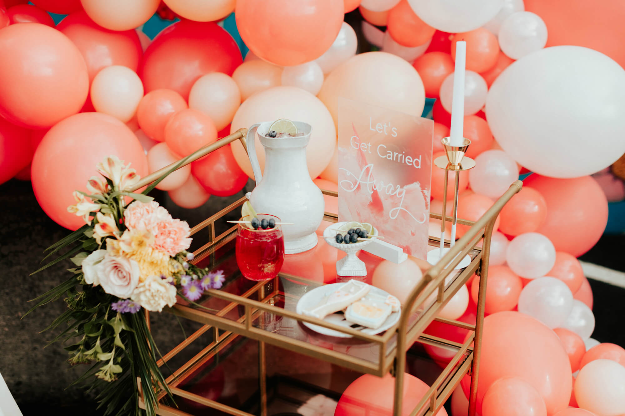 gold bar cart wedding pink balloons