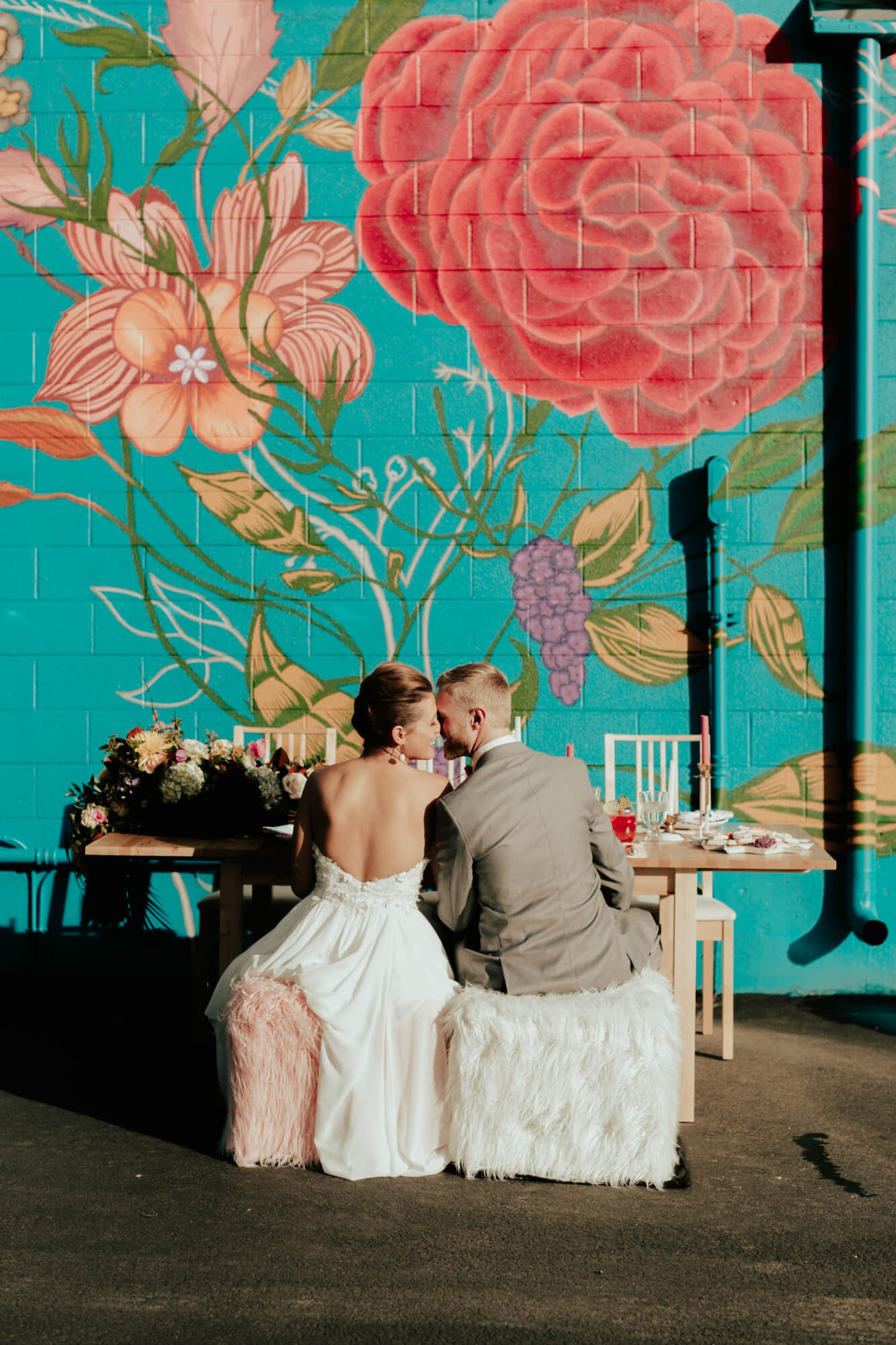 bride and groom at table mural backdrop