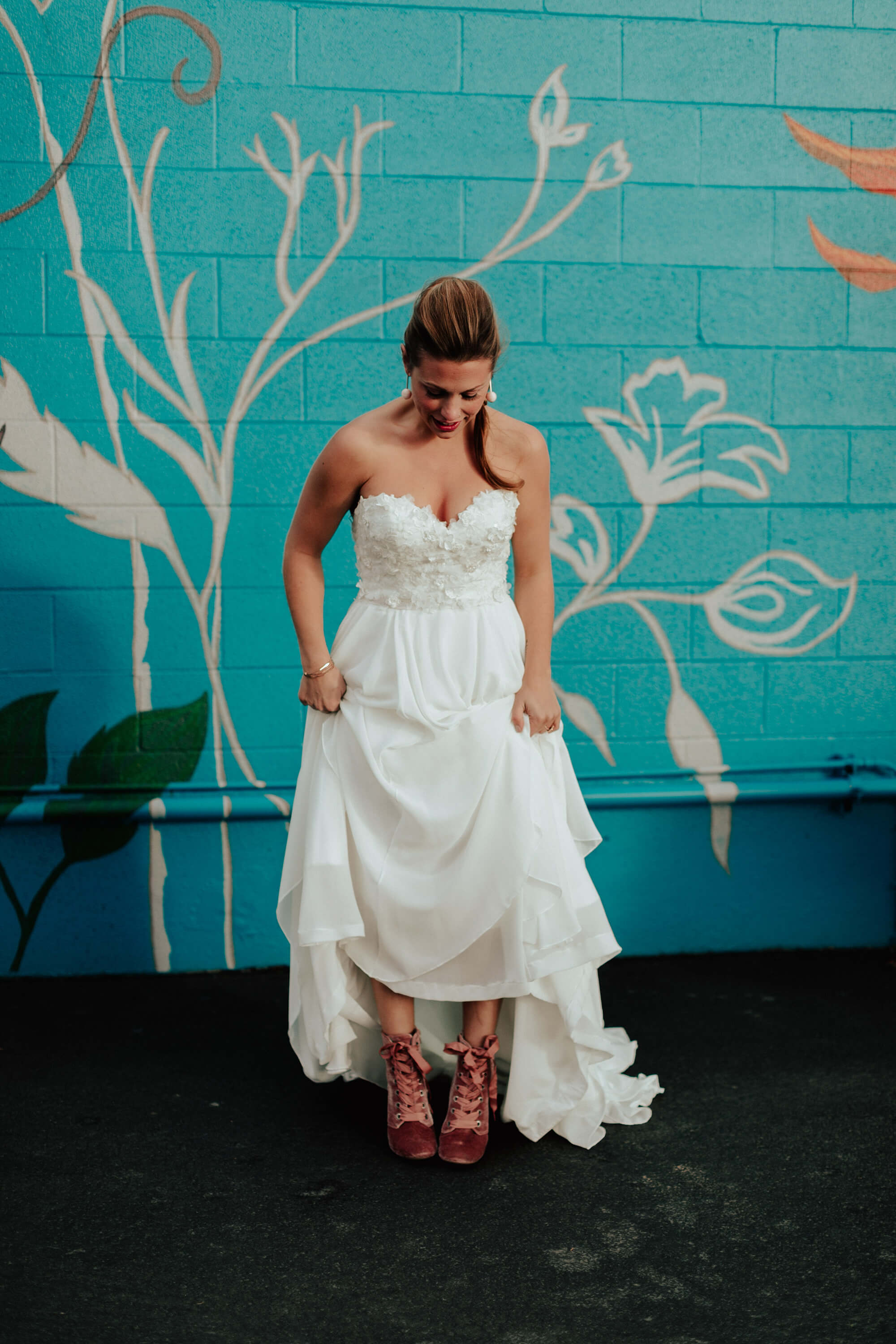 bride in white gown and pink velvet boots