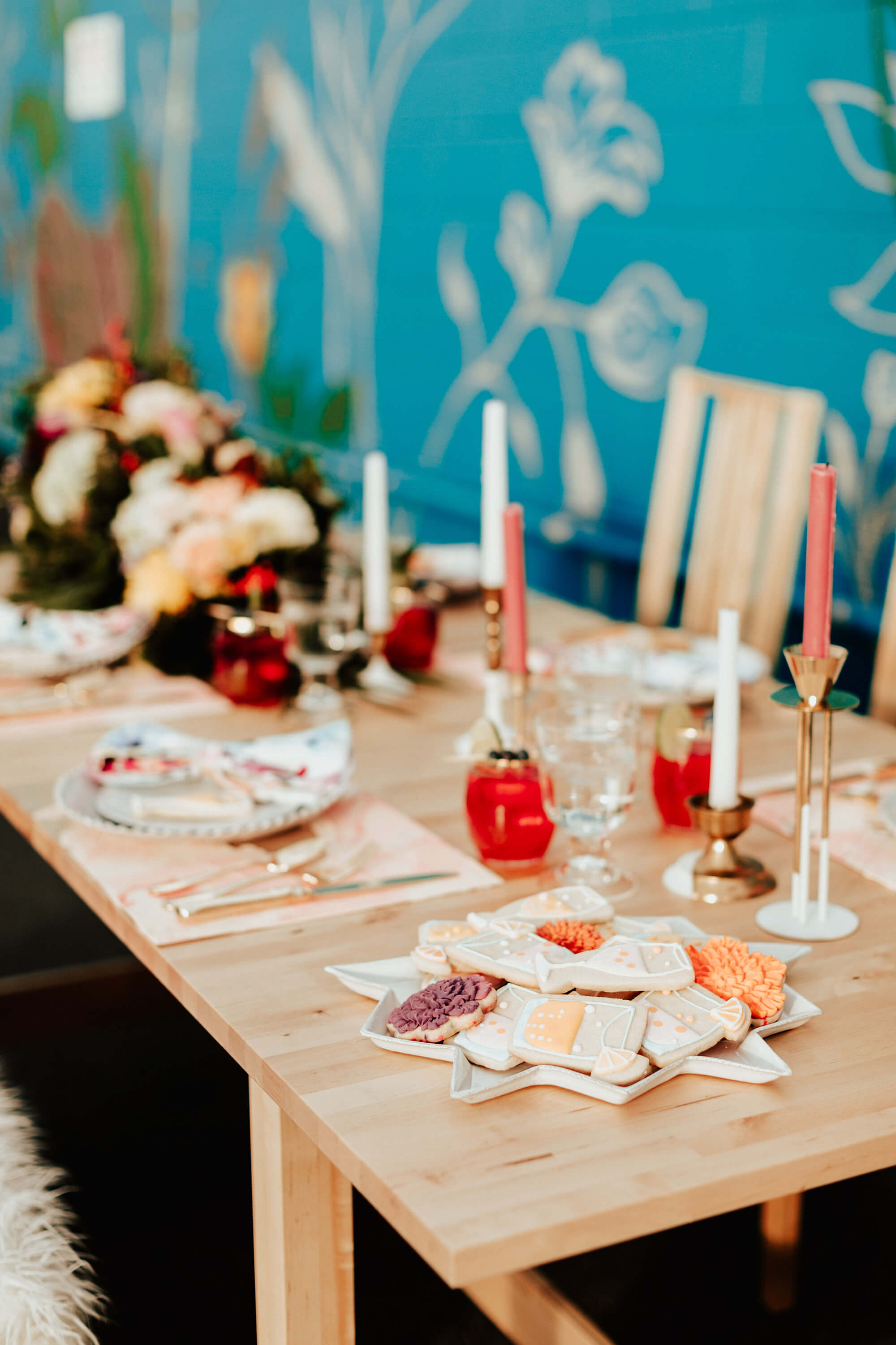 modern peach wedding tablescape with florals and candles