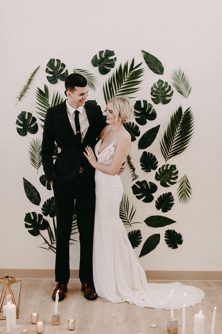 modern tropical leaf wall minimal wedding