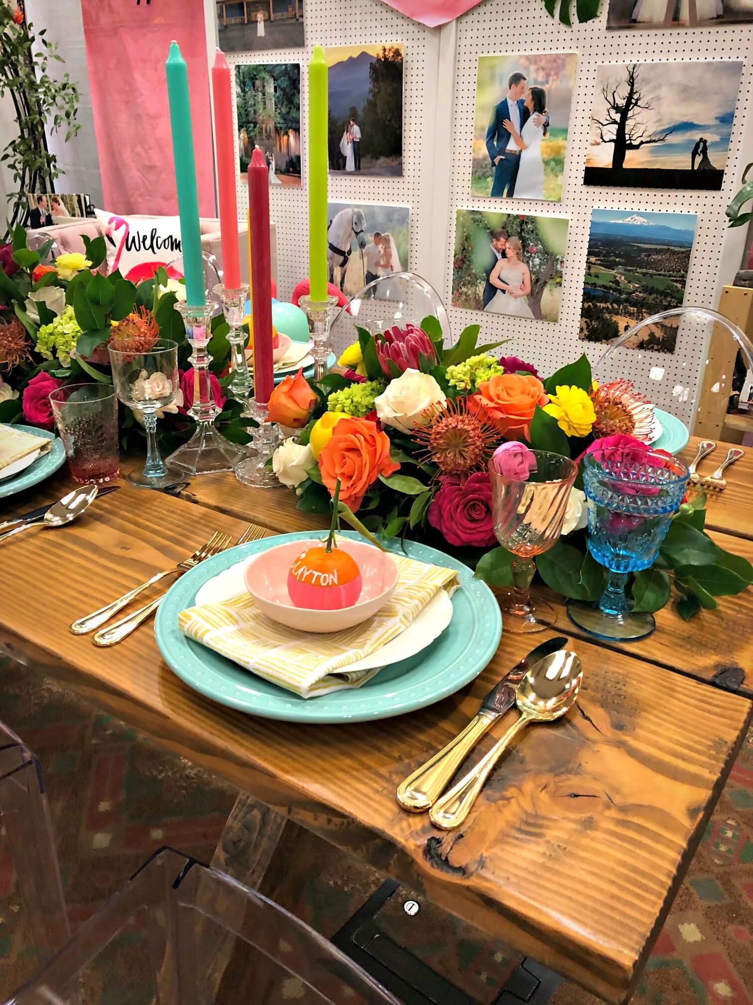 tropical tablescape with flowers and colored candles
