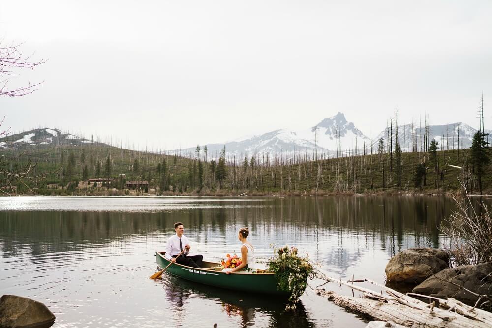 bride and groom wedding canoe on lake