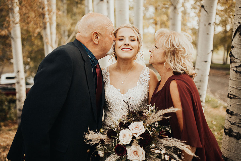 bride with mother and father photo fall wedding