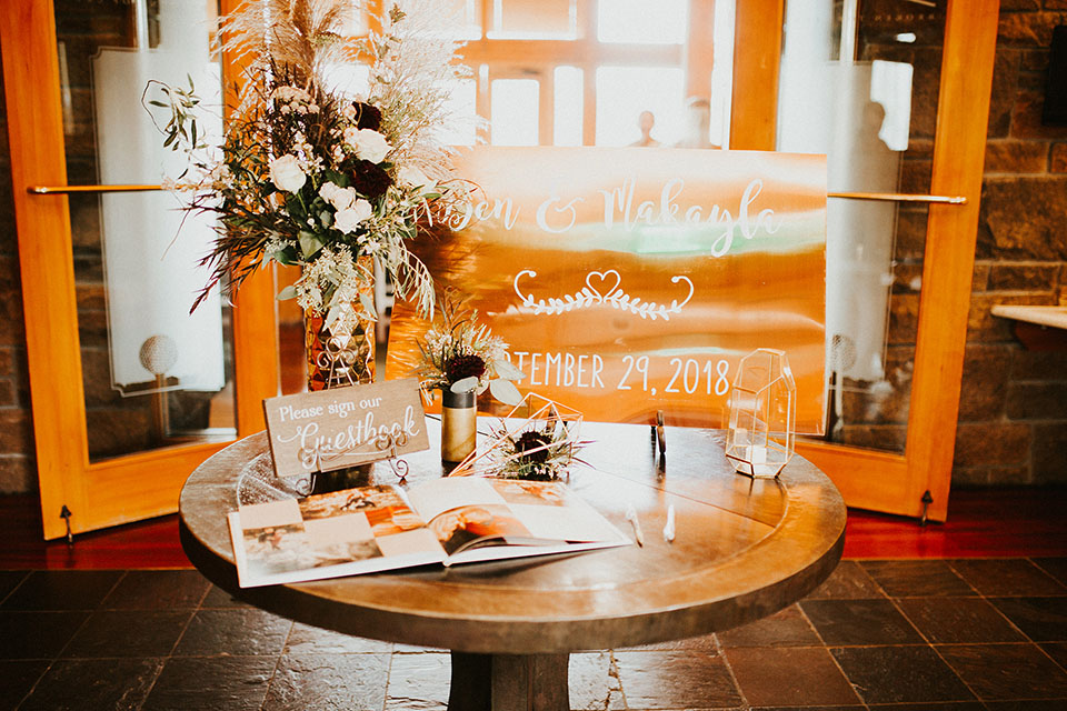 copper welcome sign with guest book