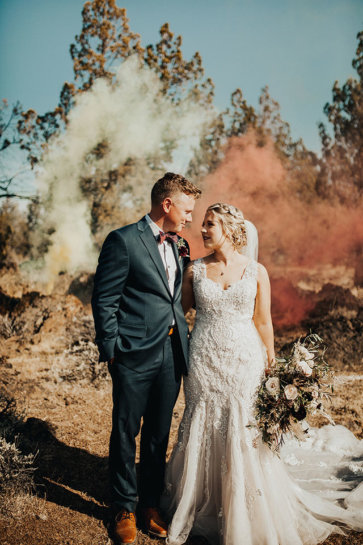 bride and groom fall wedding smoke bombs