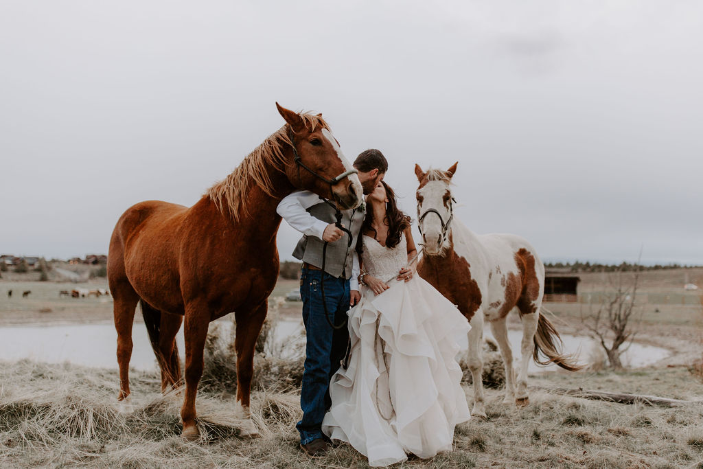 bride and groom with horses brasada ranch