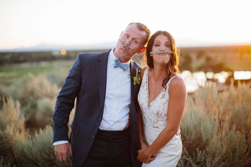 bride and groom with fake sage mustaches