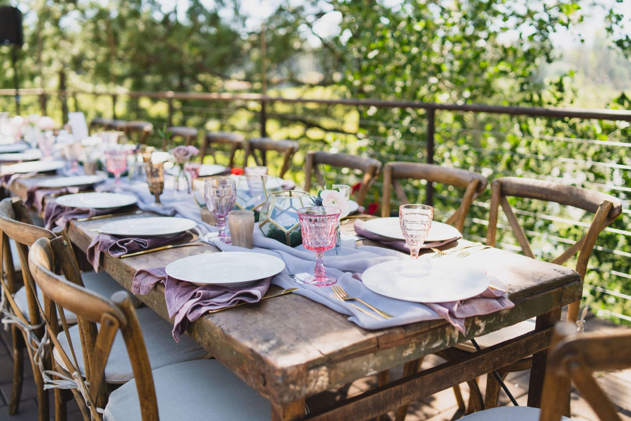 wooden farm table with place settings