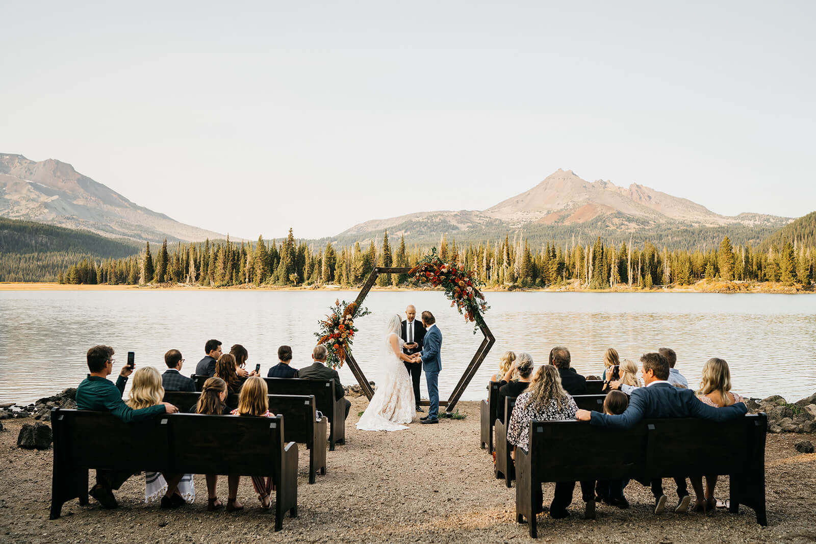 wedding ceremony with mountain and lake view