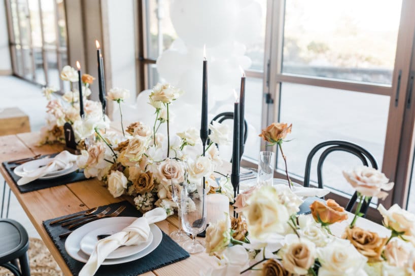 table with roses and black candles