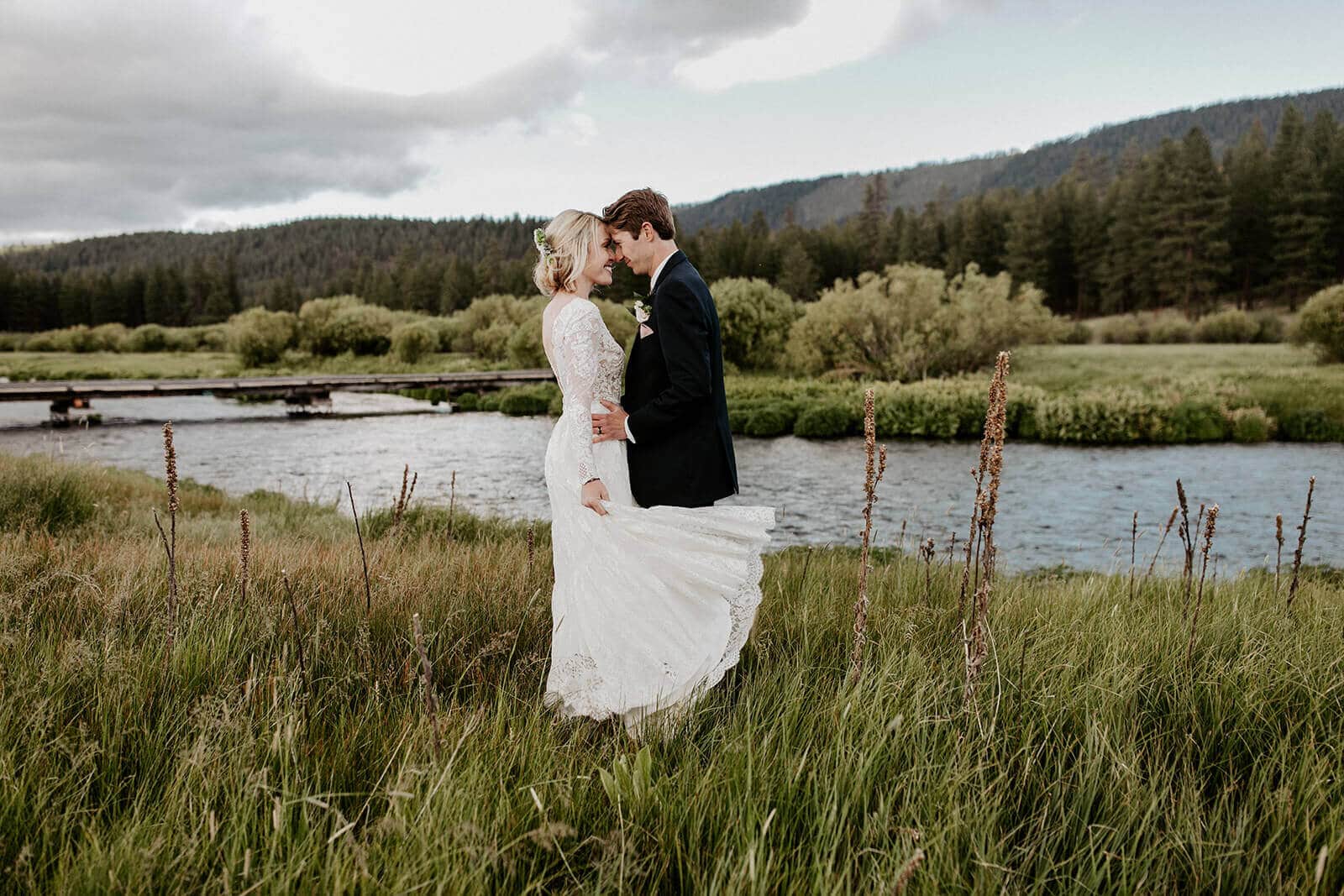 Bride and groom in front of the Metolius River